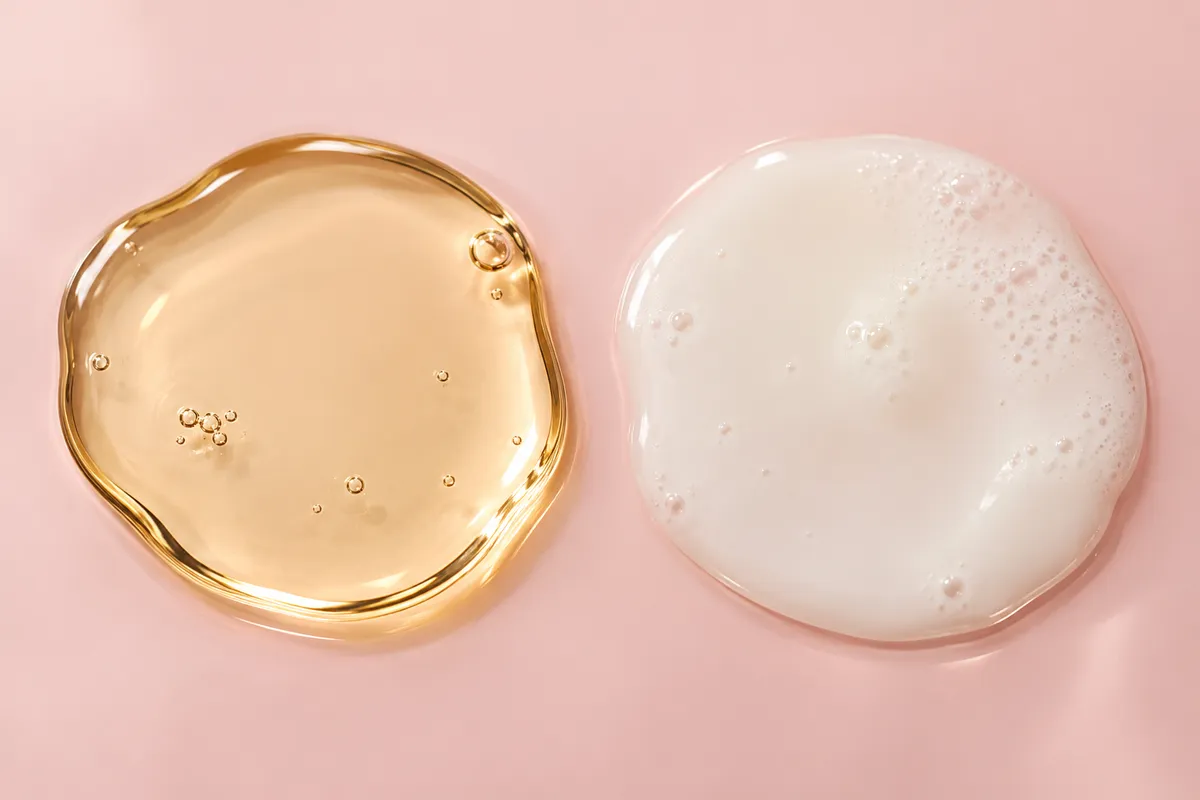 Clear cleansing oil next to the same oil turned milky with water